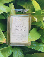 Load image into Gallery viewer, Leaf Me Alone wax melt scented with bamboo honeysuckle and orchid surrounded by plants

