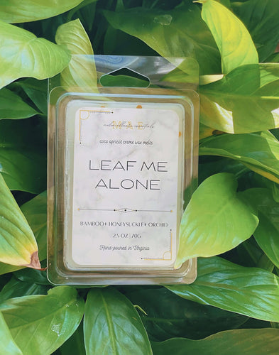 Leaf Me Alone wax melt scented with bamboo honeysuckle and orchid surrounded by plants