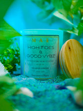 Cargar imagen en el visor de la galería, High Tides Good Vybz candle scented with ozone dark musk and powder in a fish tank
