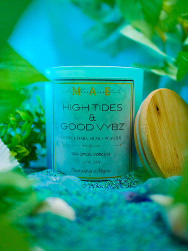 High Tides Good Vybz candle scented with ozone dark musk and powder in a fish tank